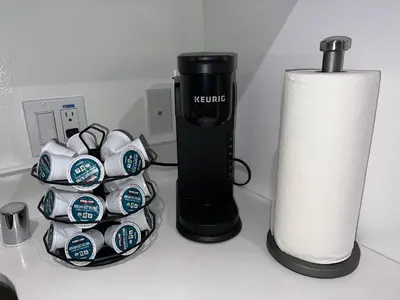 a counter top with a charger and a lamp and a roll of paper towels at Downtown Los Angeles Skyline balcony view Modern Penthouse in Los Angeles