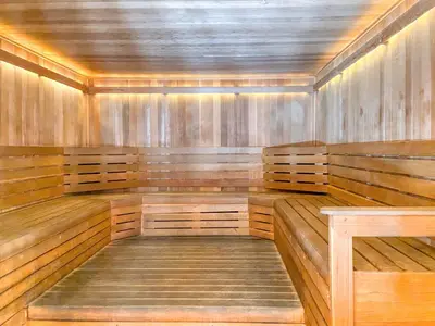 an empty wooden sauna with wooden benches in a room at Hollywood studio w pool concierge nr shops LAX-1088 in Los Angeles