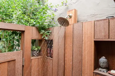 a wooden fence with potted plants on top of it at Casa Superba - Peaceful Sanctuary in Venice in Los Angeles
