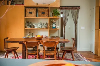 a dining room with a wooden table and chairs at Casa Superba - Peaceful Sanctuary in Venice in Los Angeles