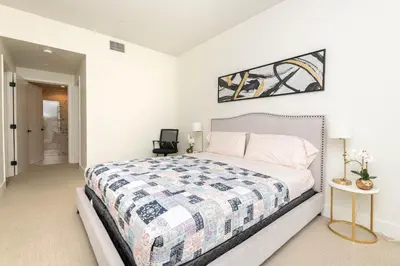 a bedroom with a bed with a quilt on it at Spacious 3Bedroom Apt close to LAX & Sofi Stadium* in Los Angeles