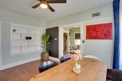 a dining room with a wooden table and chairs at 1 Mi to Dtwn! Bright Long Beach Apartment in Long Beach
