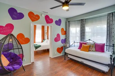 a bedroom with hearts painted on the wall at 1 Mi to Dtwn! Bright Long Beach Apartment in Long Beach