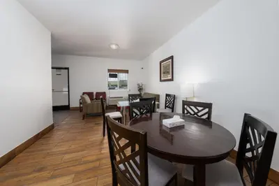 a dining room with a table and chairs at America Inn & Suites in Ridgecrest