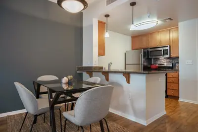 a kitchen and dining room with a table and chairs at Playa del Rey 1BR w Gym WD Pool nr LAX Beach LAX-147 in Los Angeles