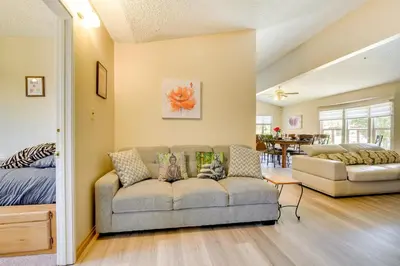 a living room with a couch and a bed at Tranquil Maricopa Retreat with Pool and Hot Tub in Maricopa