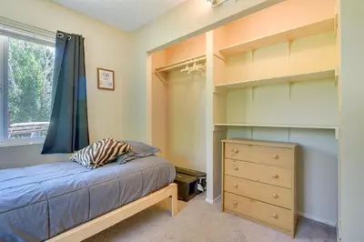 a bedroom with a bed and a dresser and a window at Tranquil Maricopa Retreat with Pool and Hot Tub in Maricopa