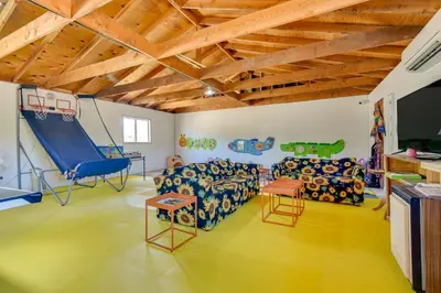 a living room with a couch and a swing at Tranquil Maricopa Retreat with Pool and Hot Tub in Maricopa