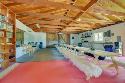 a room with a long row of tables with feather seats at Tranquil Maricopa Retreat with Pool and Hot Tub in Maricopa