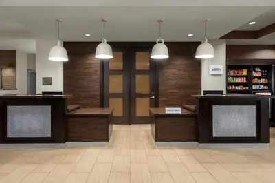 a lobby with a door and some pendant lights at Fairfield Inn & Suites Riverside Corona/Norco in Norco