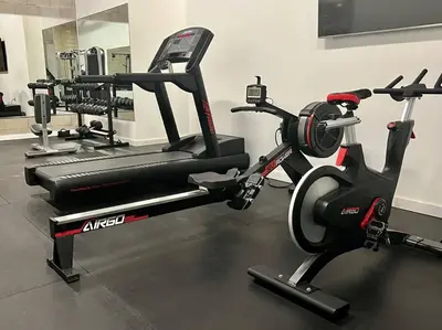 a gym with two exercise bikes in a room at Luxe Corner Penthouse 1BR Condo on Sunset in Los Angeles