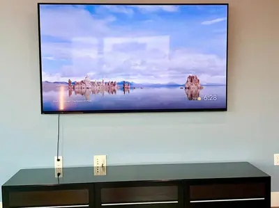 a flat screen tv sitting on top of a wall at Luxe Corner Penthouse 1BR Condo on Sunset in Los Angeles