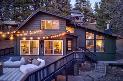 a house with a porch with lights on it at Ferndale woods in Running Springs