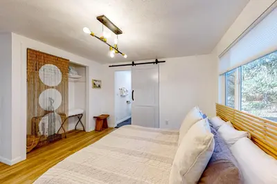 a bedroom with a large bed and a window at Ferndale woods in Running Springs