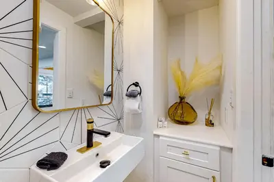 a bathroom with a sink and a mirror at Ferndale woods in Running Springs
