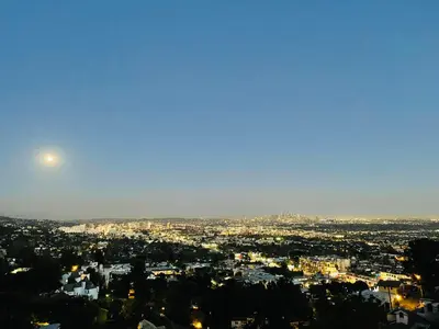 a view of a city at night with the moon at Vista Bliss Retreat-Private Room in Los Angeles