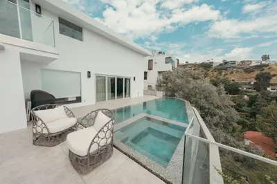 a house with a swimming pool on a balcony at Exclusive Hillside Hideaway-Private Room in Los Angeles