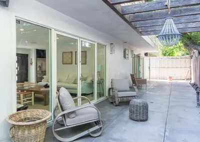 a room with a patio with a chair and a bed at Cali Luxury Dream Hideaway in Woodland Hills