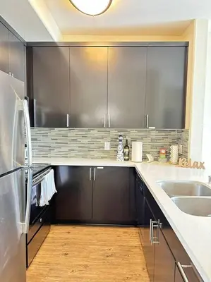 a kitchen with stainless steel cabinets and a sink at Marina Del Rey Apartment Luxury pool, gym, parking, BBQ in Los Angeles