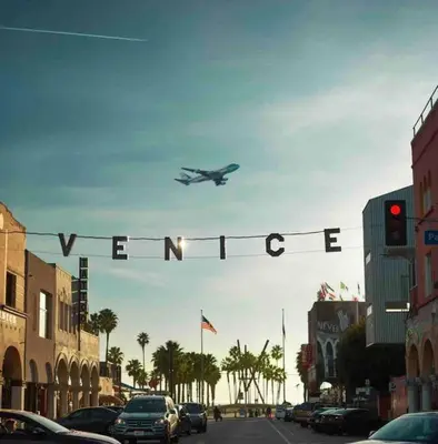 an airplane is flying over a street with a traffic light at Marina Del Rey Apartment Luxury pool, gym, parking, BBQ in Los Angeles