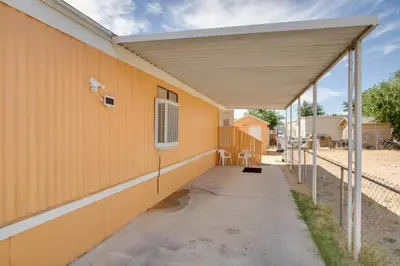 an empty building with a yellow wall at Rosamond Vacation Rental with Grill, Near Vineyards! in Rosamond