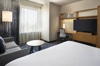 a hotel room with a bed and a tv at Courtyard by Marriott Los Angeles L.A. LIVE in Los Angeles