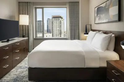 a hotel room with a large bed and a window at Residence Inn by Marriott Los Angeles L.A. LIVE in Los Angeles