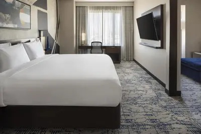 a hotel room with a large bed and a flat screen tv at Residence Inn by Marriott Los Angeles L.A. LIVE in Los Angeles
