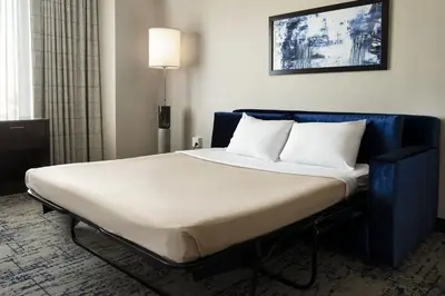 a bed with two pillows on it in a room at Residence Inn by Marriott Los Angeles L.A. LIVE in Los Angeles
