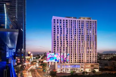 a tall building with lights on it in a city at Residence Inn by Marriott Los Angeles L.A. LIVE in Los Angeles