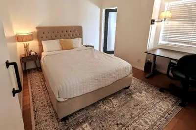 a bedroom with a bed and a desk and a bed sidx sidx sidx at Monthly - Cozy 1 Bed Guest Suite near Venice Beach in Los Angeles