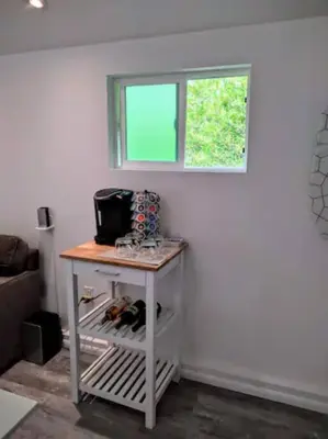 a small table in a room with a window at Monthly - Cozy 1 Bed Guest Suite near Venice Beach in Los Angeles
