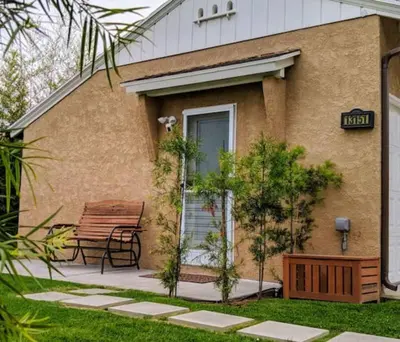 a bench sitting in front of a house at Monthly - Cozy 1 Bed Guest Suite near Venice Beach in Los Angeles