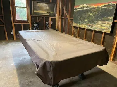 a large bed in a room with a painting at Pool Table A C Grill Out Netflix Bikes Yard in Fullerton