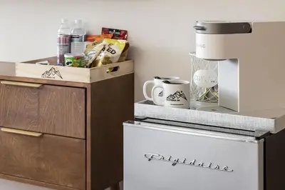 a kitchen with a counter with a coffee maker at California Inn in Anaheim