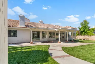 a house with a pathway in front of it at Stylish & Bright ~ Huge Backyard ~ King Beds ~ Pkg in Palmdale
