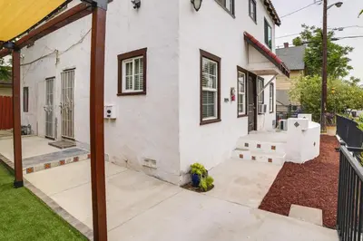 a patio outside of a white house at Pet-Friendly Riverside Vacation Rental with Patio! in Riverside