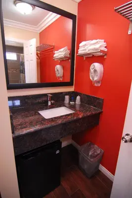 a bathroom with a sink and a mirror at Studio City Inn - Near Universal Studios Hollywood in Los Angeles