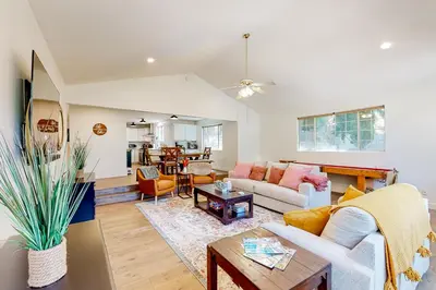 a living room with a couch and a table at Lake Gregory Escape in Crestline