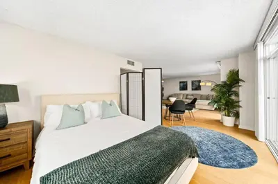 a bedroom with a large bed and a desk at Smoky Quartz -Marina View Spacious 3BR near Yacht Club in Los Angeles