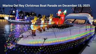 a boat covered in christmas lights on the water at Smoky Quartz -Marina View Spacious 3BR near Yacht Club in Los Angeles