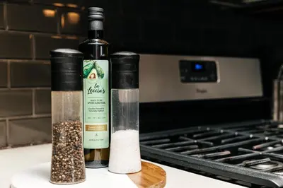 two bottles of wine on a counter next to a stove at Stylish Vibes 1BD in WEHO in Los Angeles
