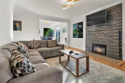 a living room with a couch and a fireplace at Oaks Garden in Thousand Oaks