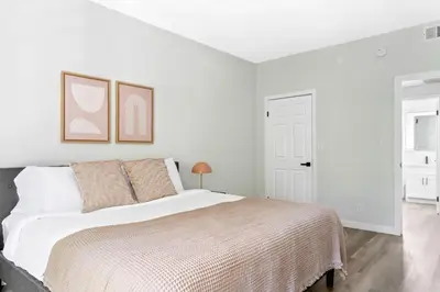 a white bedroom with a large bed with white walls at Westwood 2BR nr Westwood Village LAX-902 in Los Angeles