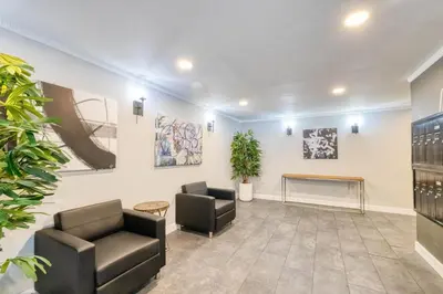 a waiting room with two chairs and paintings on the wall at Westwood 2BR nr Westwood Village LAX-902 in Los Angeles