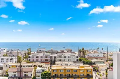 a city with buildings and the ocean in the background at Garnet Glow Full Ocean and Venice Beach view 3BR in Los Angeles