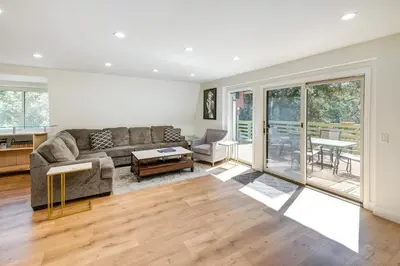 a living room with a couch and a table at Modern Pine Mountain Club Cabin with Community Pool! in Pine Mountain Club