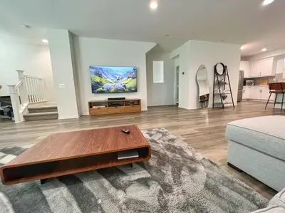 a living room with a couch and a coffee table at Modern Lux Home Near Disneyland And In The Heart Of OC! in Santa Ana