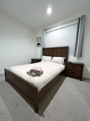 a bedroom with a large bed and a window at Modern Lux Home Near Disneyland And In The Heart Of OC! in Santa Ana