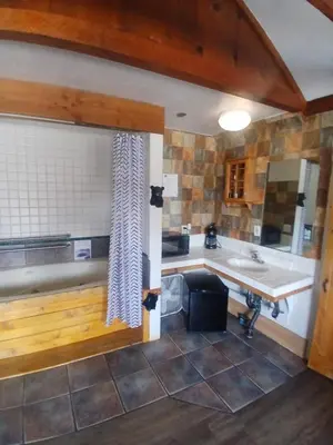a bathroom with a sink and a counter top at The Village Cabins in Big Bear Lake